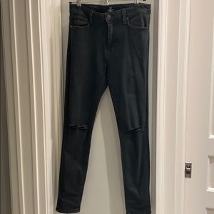 Very dark green (almost black) jeans with slits